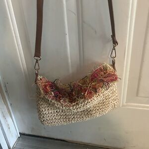 NWOT INC crochet bag with adjustable strap.